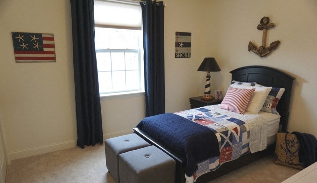 a bedroom with a bed and an and a window