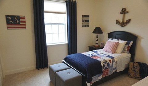 a bedroom with a bed and an and a window