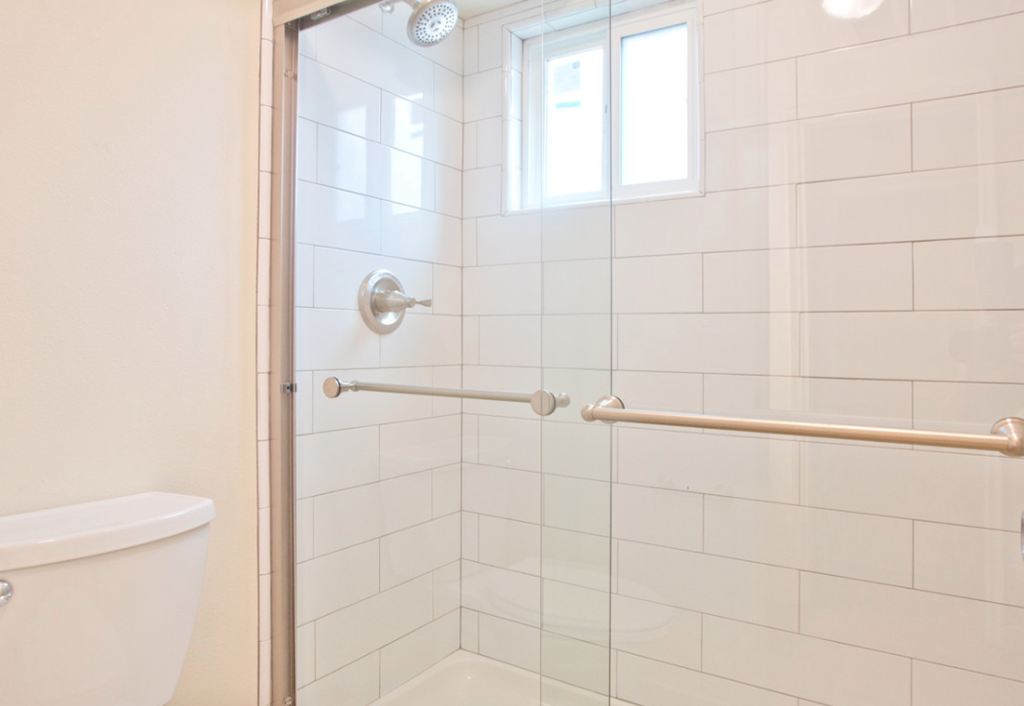 a bathroom with a shower and a toilet