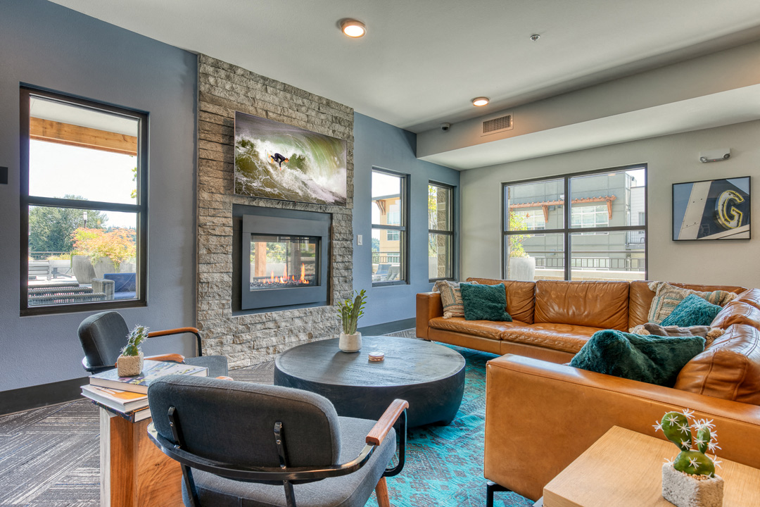 a living room with couches and chairs and a fireplace