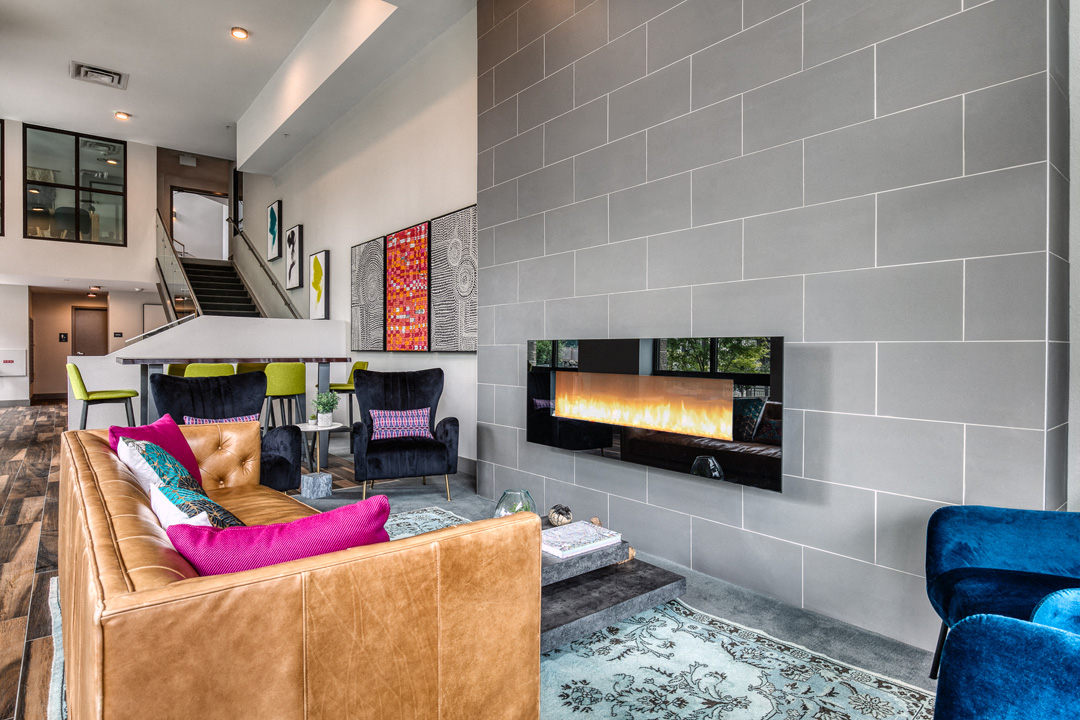 a living room with a couch and a fireplace