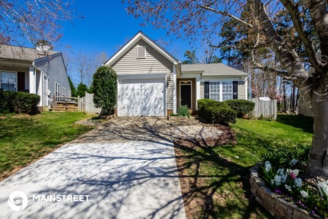 a house with a driveway and a white garage door