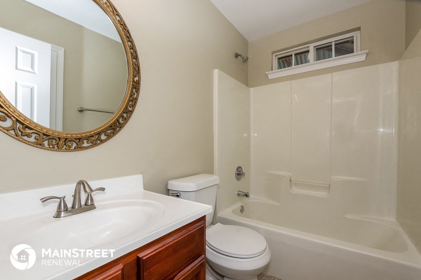 a bathroom with a sink toilet and a shower