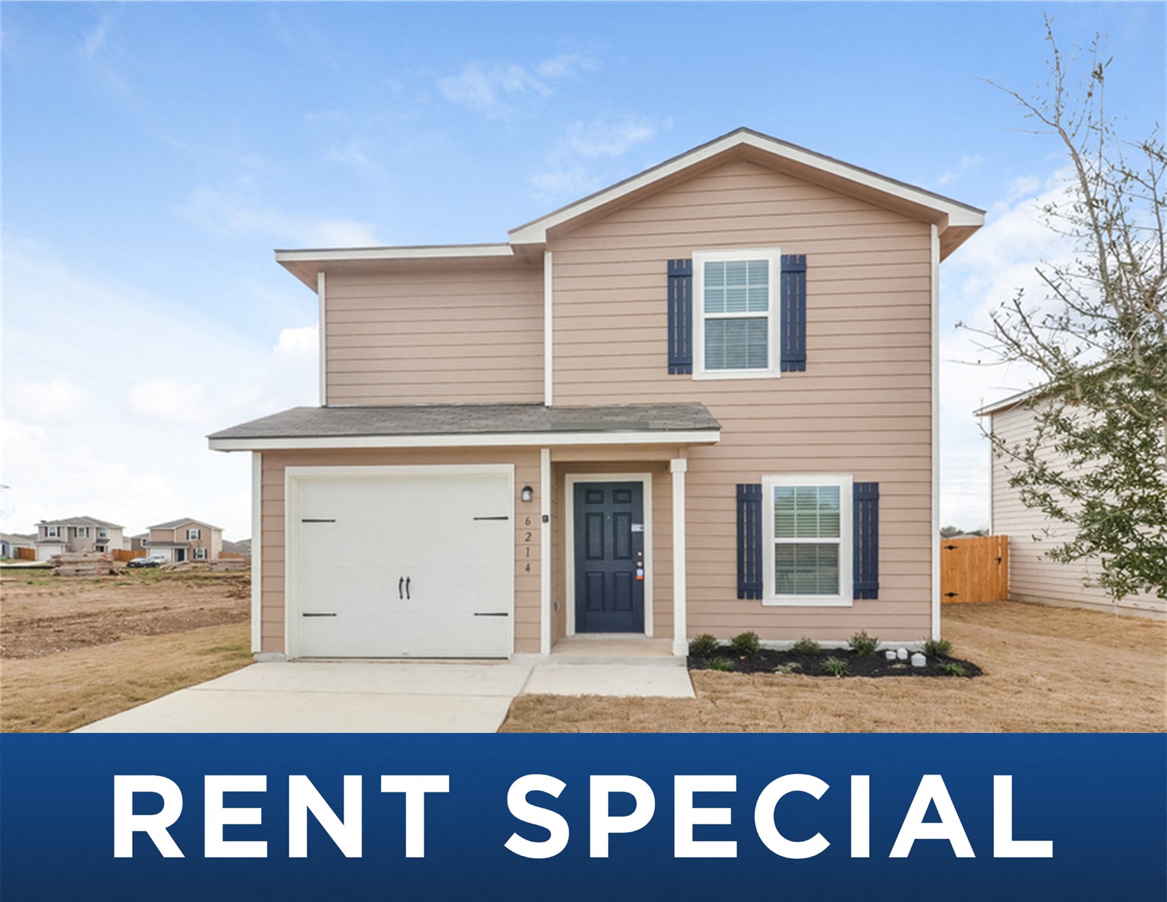 a tan and brown rental house with the rent special sign
