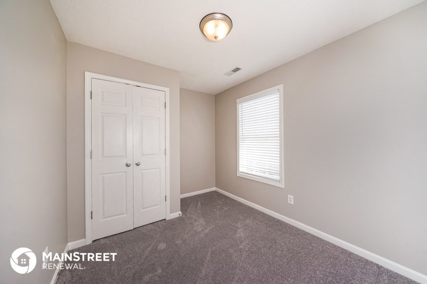 the upstairs bedroom has a large closet and a window