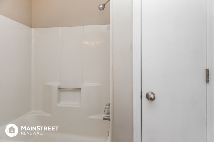 a small bathroom with a shower and a toilet