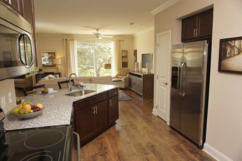a kitchen with stainless steel appliances and granite counter tops