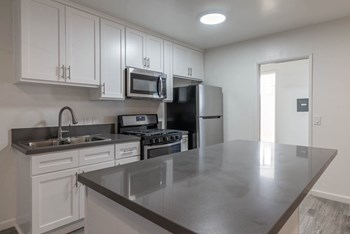 Kitchen with island and new counters and appliances - Photo Gallery 2