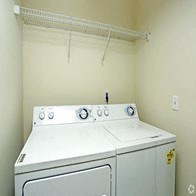 a white washer and dryer in a white room
