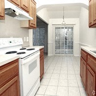 a kitchen with a white stove top oven and wooden cabinets