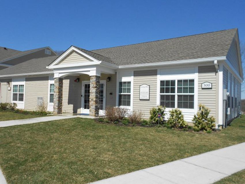 a house with a sidewalk in front of it