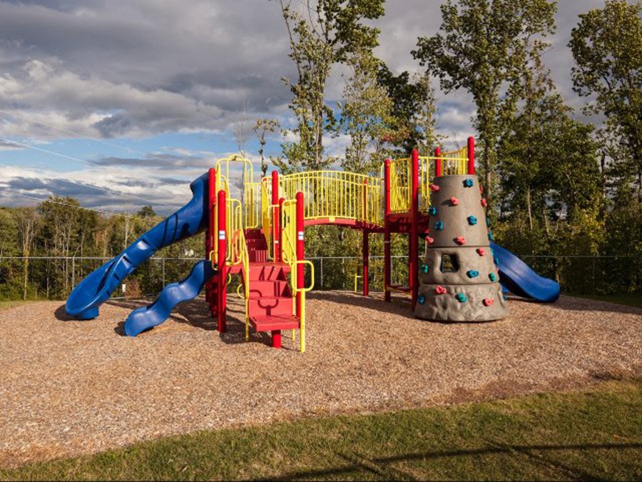 a playground with a slide and a cone
