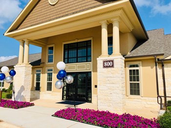 front entrance to apartment building with balloons in georgetown texas - Photo Gallery 2