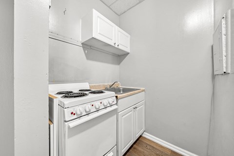 the kitchen of our studio apartment is clean and ready for us to use