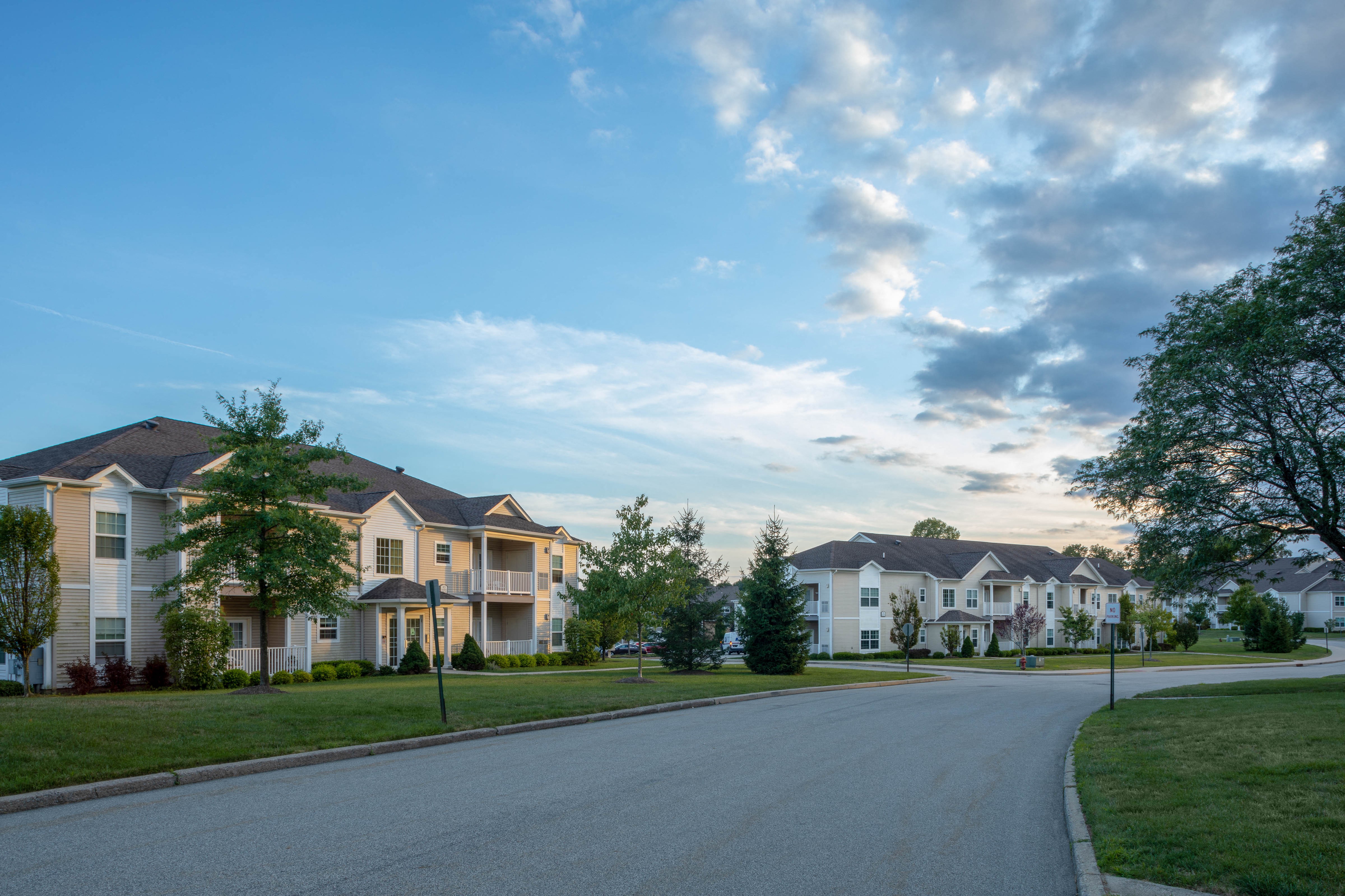 a row of houses on the side of a road