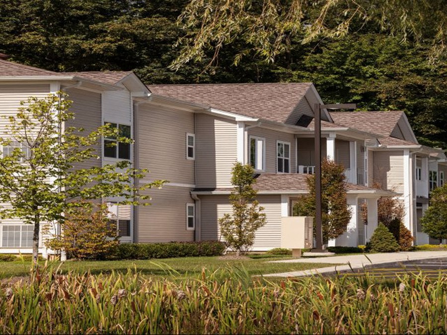 a row of houses on the side of a street