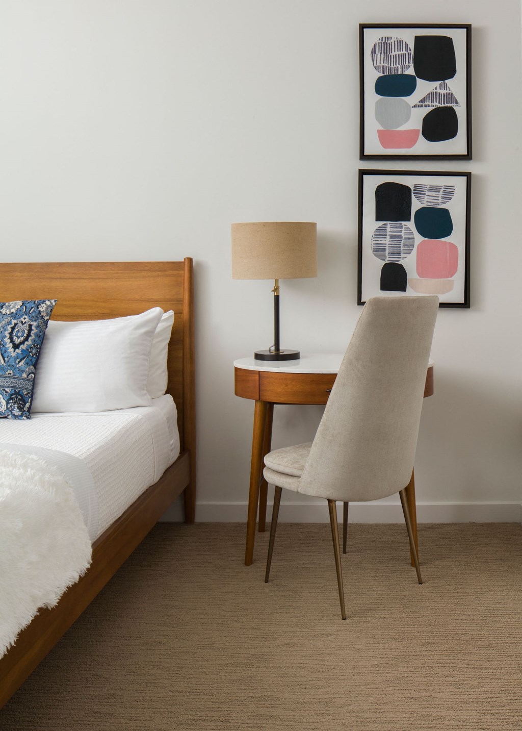 a bedroom with a bed and a desk with a chair