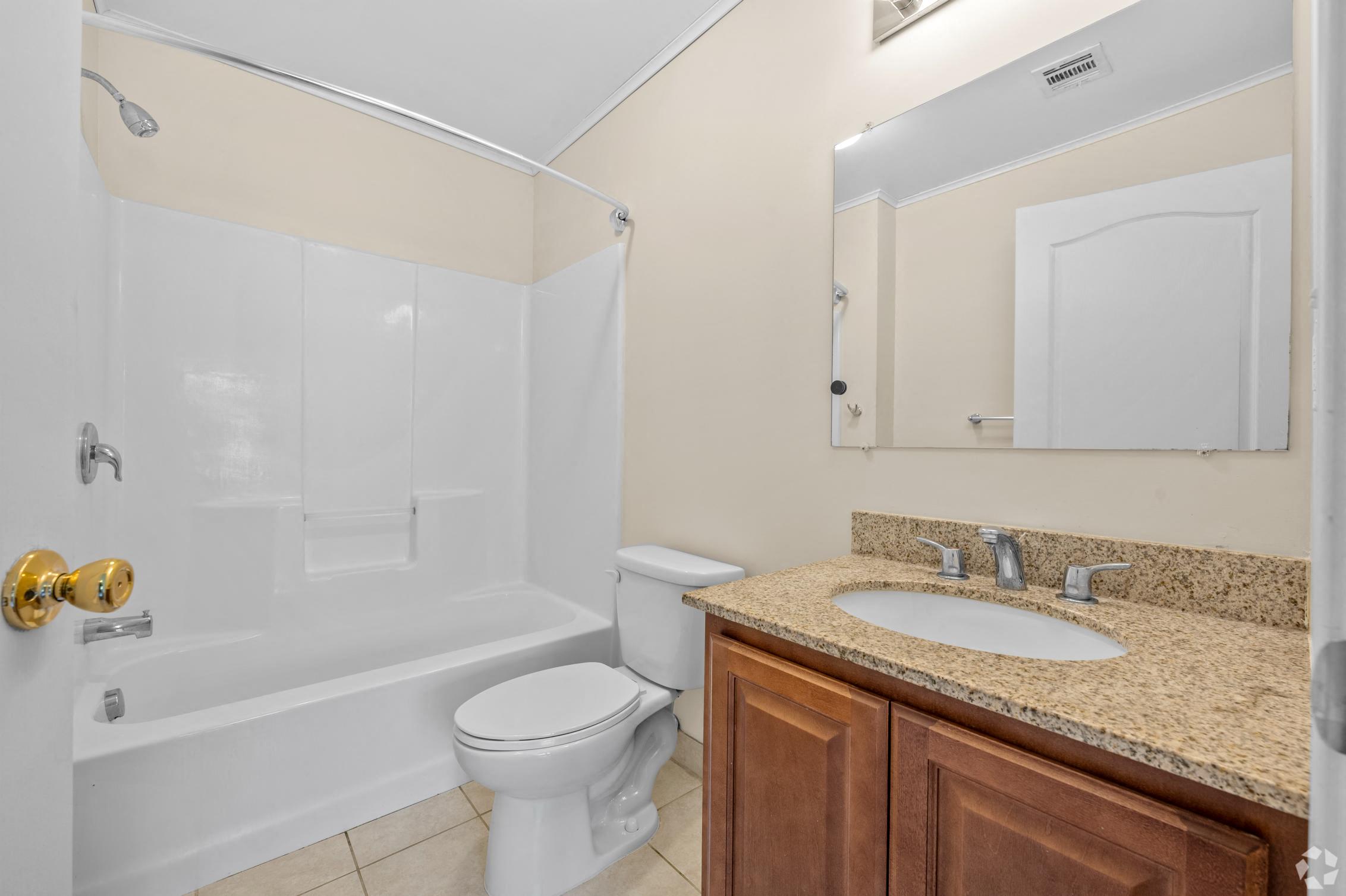 a bathroom with a sink toilet and a shower
