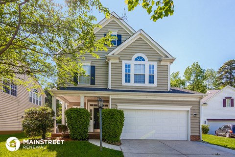 a house with a garage and a white garage door