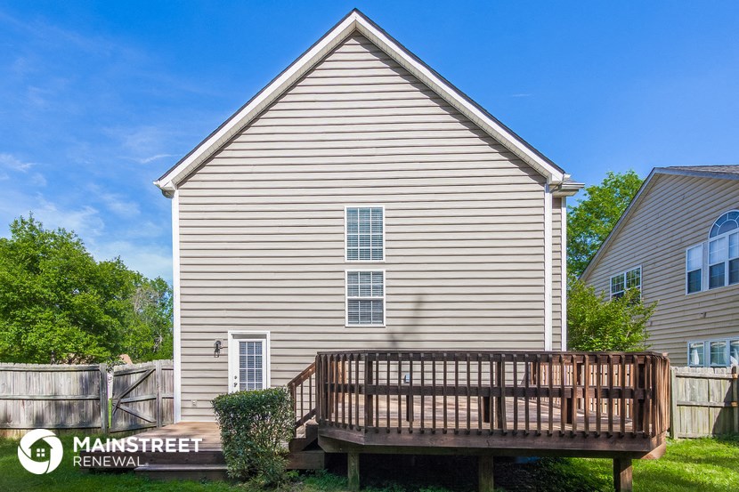 a deck on the side of a house