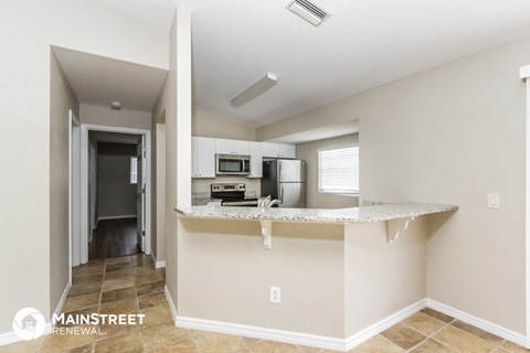 a kitchen with a granite counter top and a sink