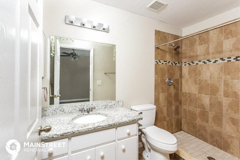 a bathroom with a sink toilet and a shower