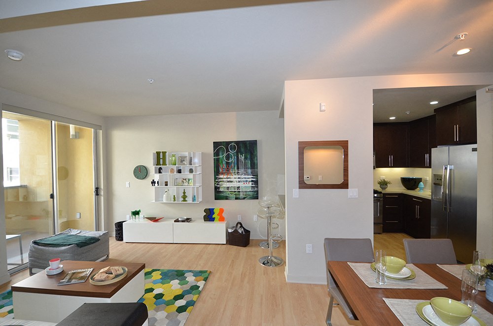 a view of the living room and kitchen from the dining room