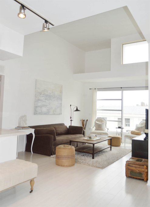 a living room with a couch and a table