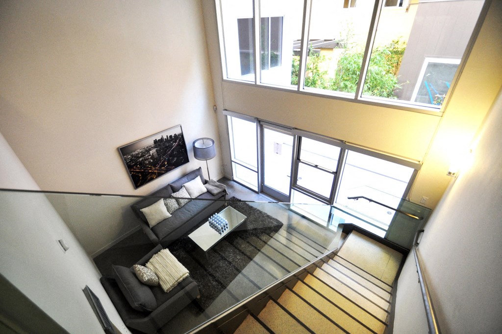a view of the living room from the second floor of a house