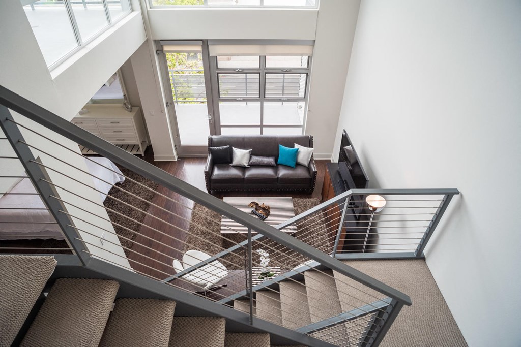 a view of the living room from the top of the stairs