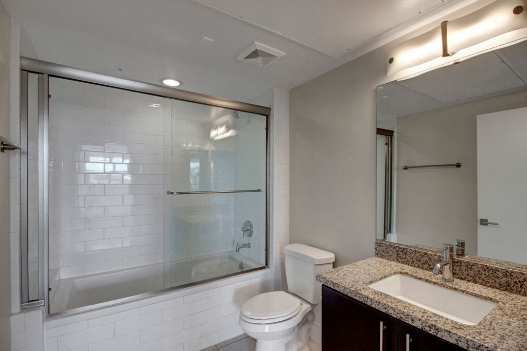 a bathroom with a sink toilet and a shower