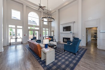 Swift Creek Commons Apartments - Resident clubhouse with fireplace - Photo Gallery 5
