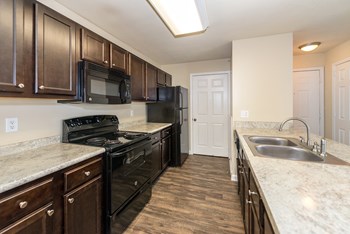 Swift Creek Commons Apartments - Interior kitchen with premium upgraded finishes - Photo Gallery 10