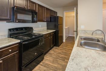 Swift Creek Commons Apartments - Wood-style flooring in select units