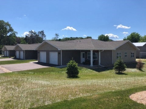 a house in a neighborhood with a grassy yard