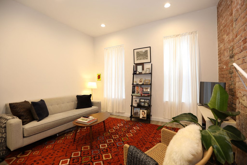 a living room with a couch and a tv