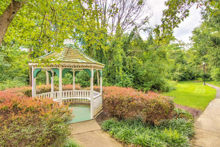 gazebo at Creekside at Taskers Chance in Frederick, MD with bushes, shrubs and grass surrounding gazebo and walkway