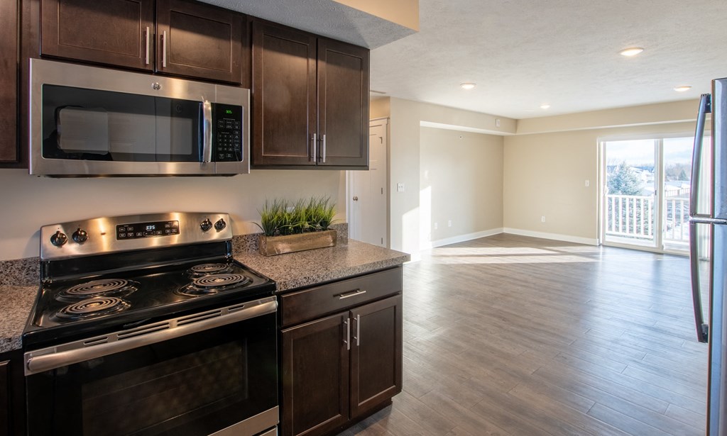 a kitchen with stainless steel appliances and a granite counter top