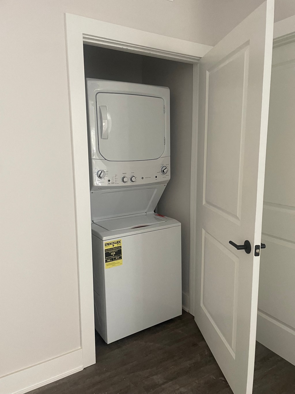 a small closet with a washer and dryer in it