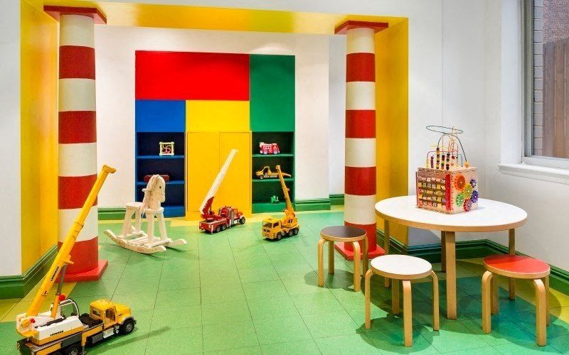 a toy room with a table and chairs