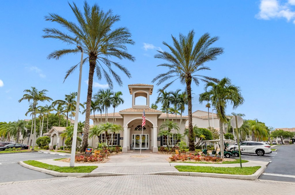 a building with palm trees in front of it