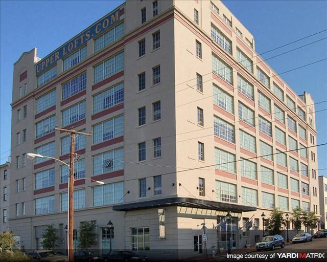 a large building with a street in front of it