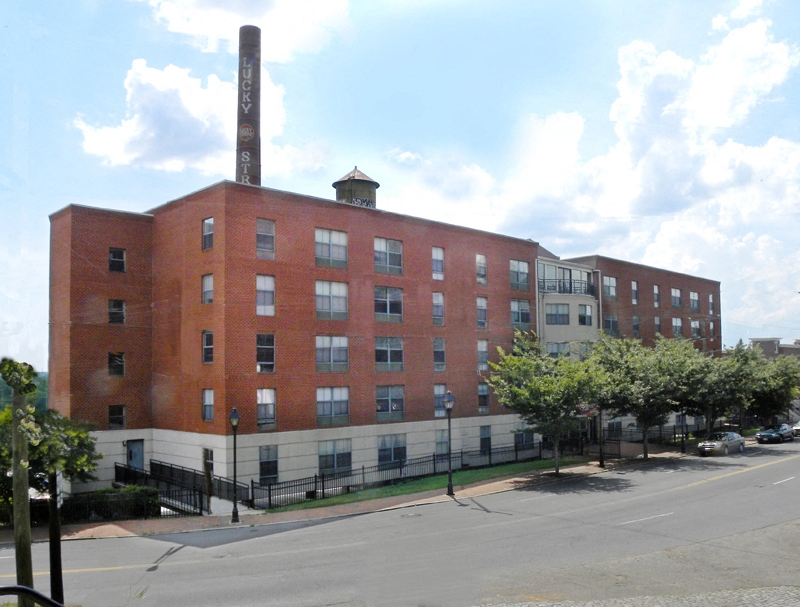 a large brick building on the side of a street