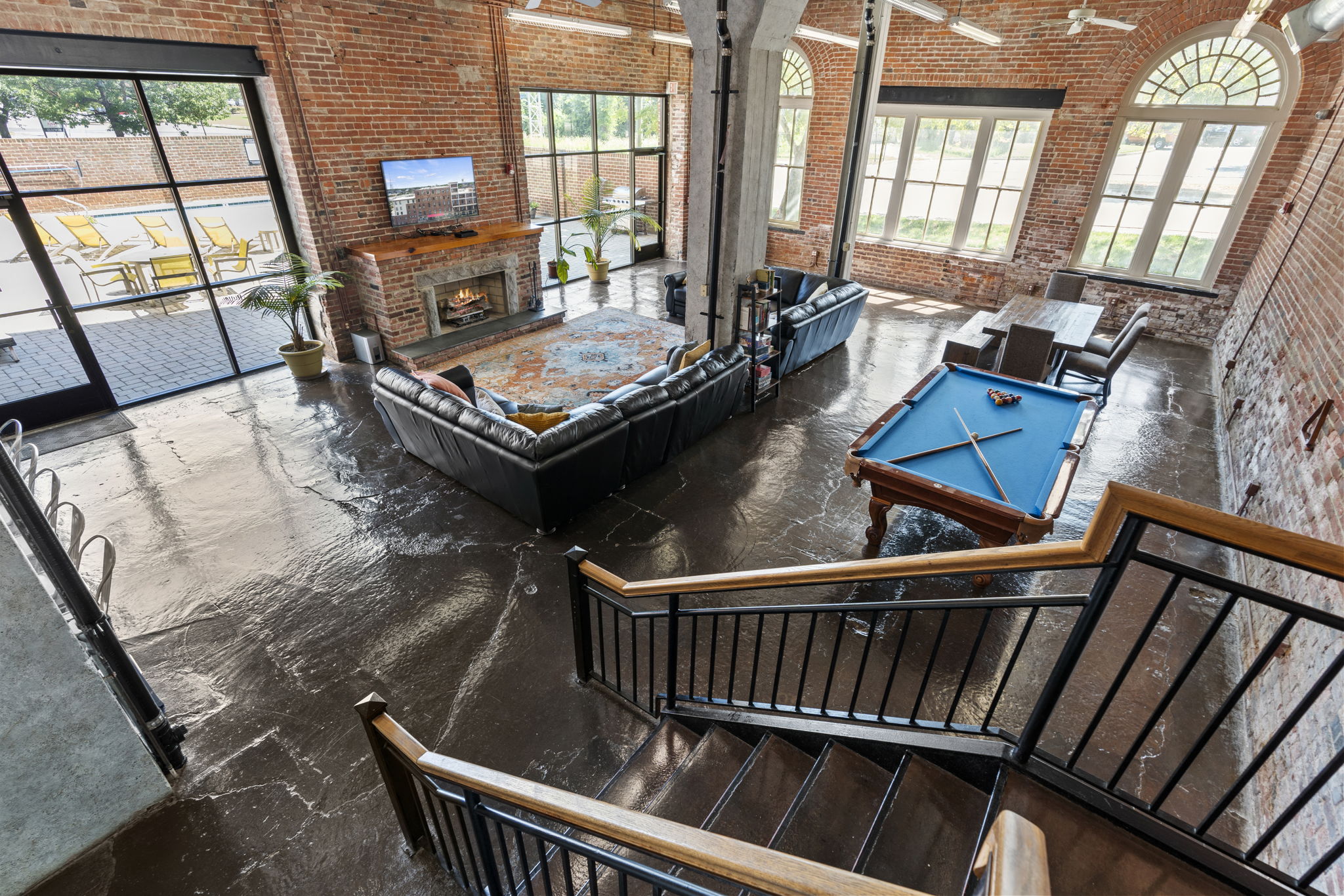 an aerial view of a living room with a pool table