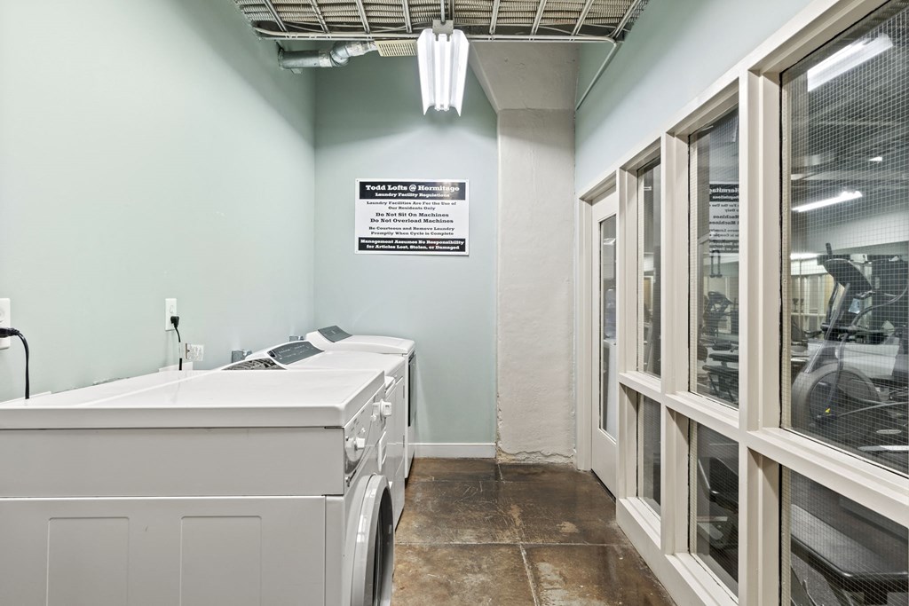 a laundry room with a sink and a washing machine