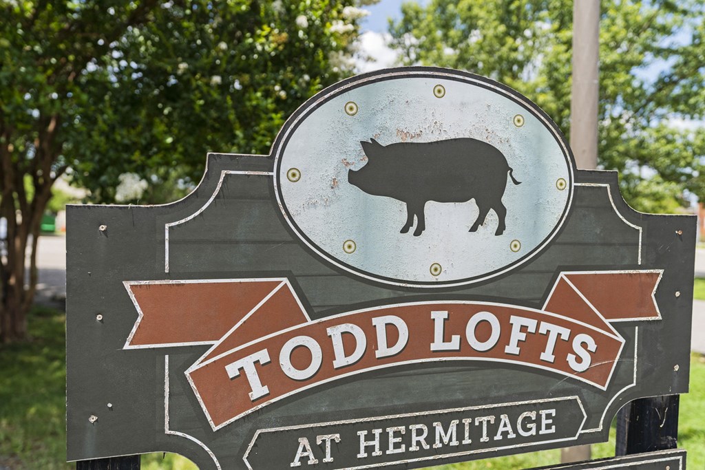 a sign that says at hermitage with a bull