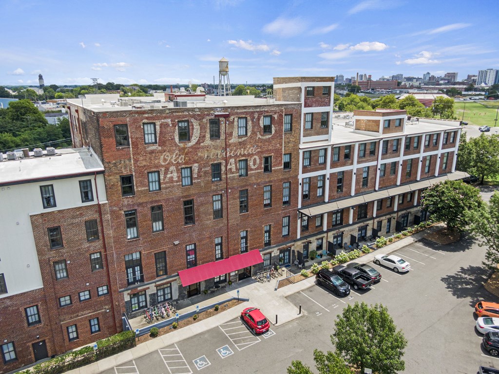an aerial view of a brick building with a red awning