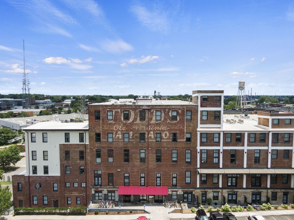 a large brick building with a sign on the side of it