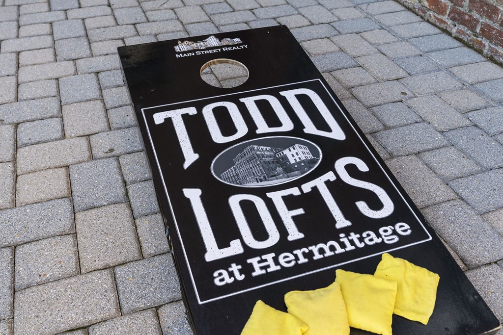 a sign that says todosloslos at thermosphere on a brick sidewalk