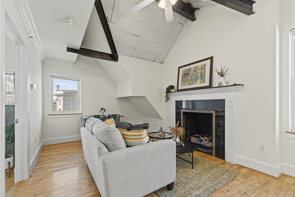 a living room with a couch and a fireplace